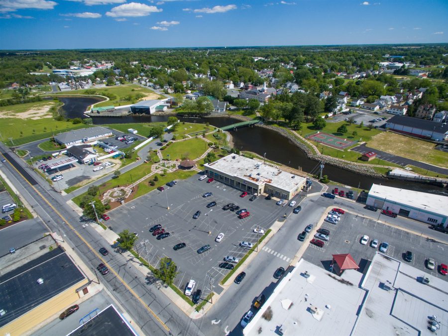 aerial view of commercial property and parking lot